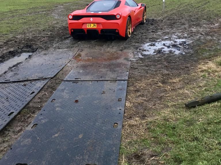 Red Ferrari 458 Italia photographed at a rural location